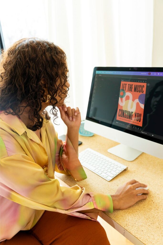 Woman Designing Poster on Canva