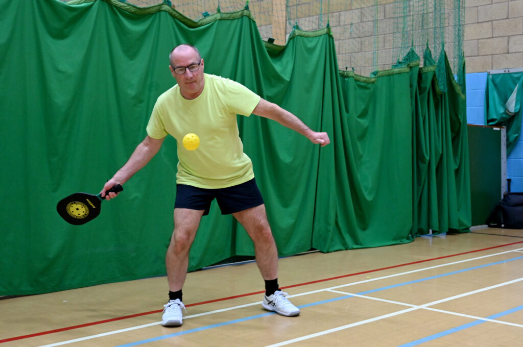 man playing pickleball