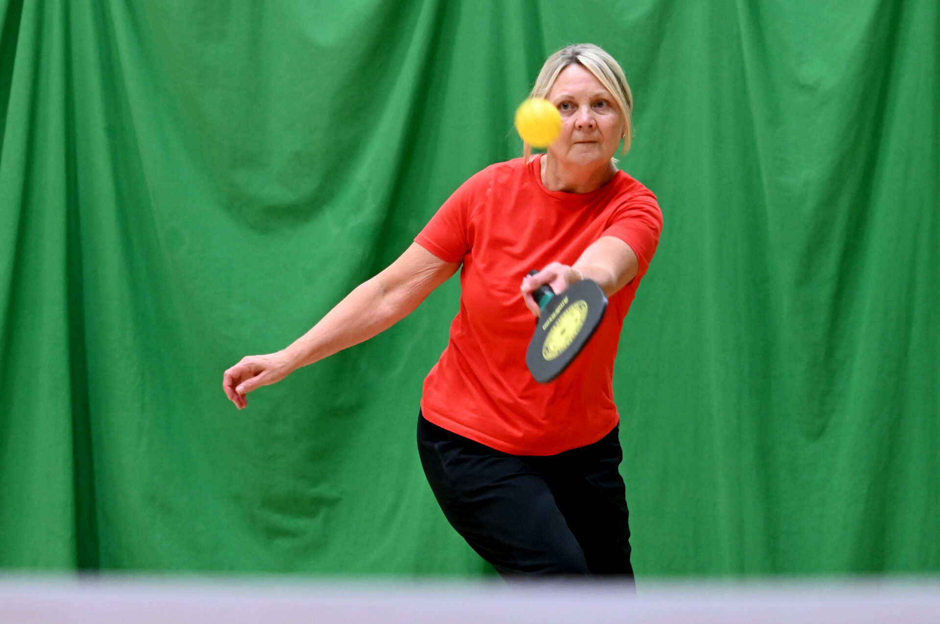woman playing pickleball